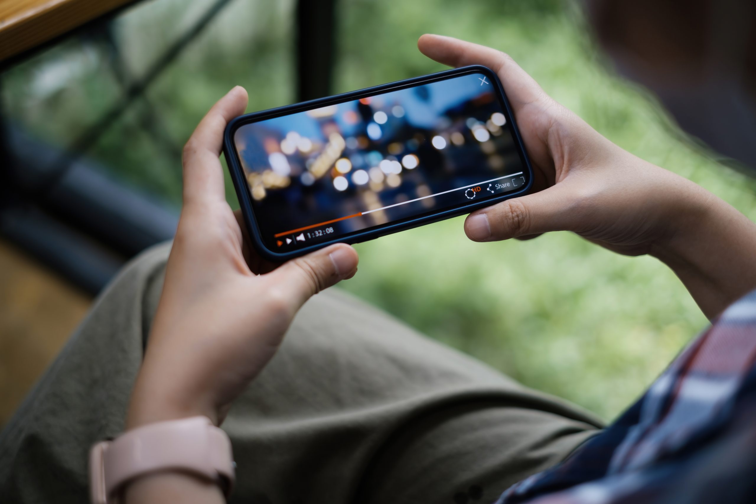 Person watching video on phone