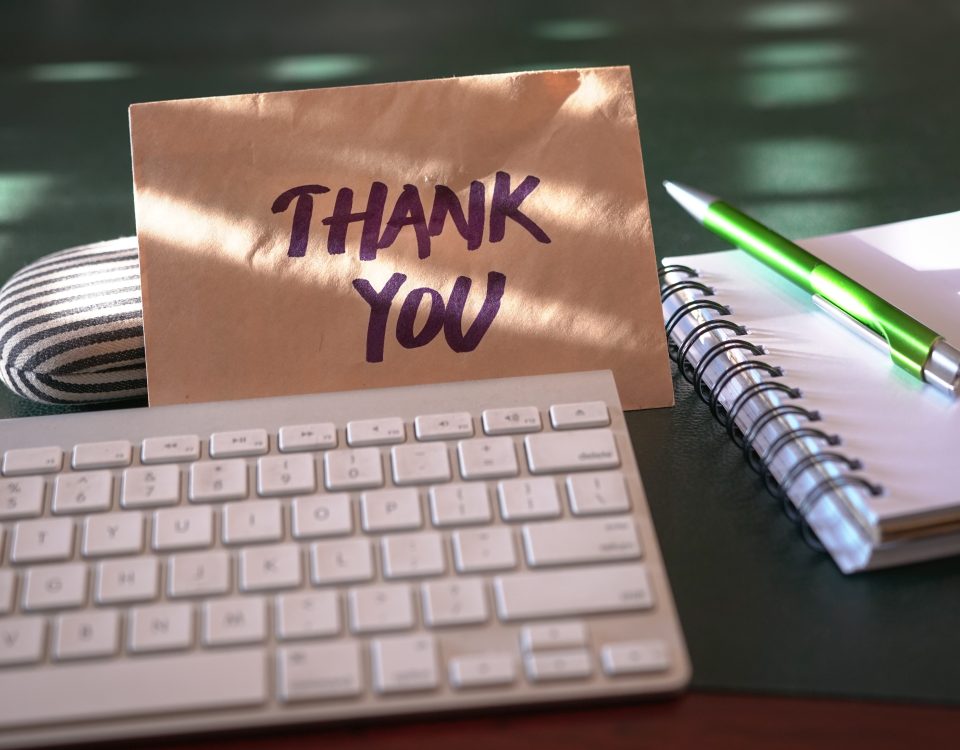 thank you card next to keyboard